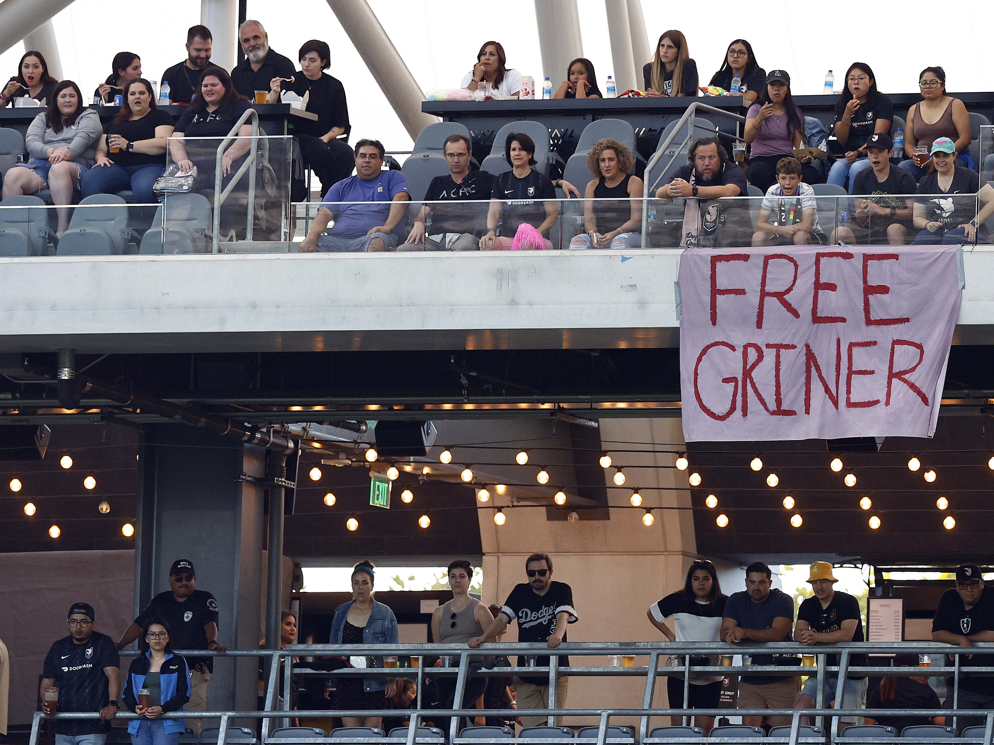 caption: A sign calls for Britney Griner's release at a game between Portland Thorns FC and Angel City FC in Los Angeles earlier this month.