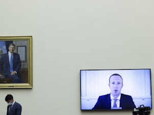 caption: Facebook CEO Mark Zuckerberg speaks via video conference during a House Judiciary subcommittee hearing on antitrust on Capitol Hill in July.