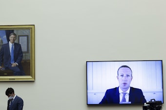caption: Facebook CEO Mark Zuckerberg speaks via video conference during a House Judiciary subcommittee hearing on antitrust on Capitol Hill in July.