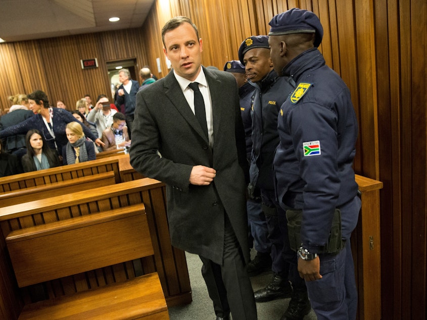 caption: Paralympian athlete Oscar Pistorius, accused of the murder of his girlfriend Reeva Steenkamp, arriving at a court in Pretoria, South Africa, for a hearing in July 2016. The athlete will be released for parole in January.