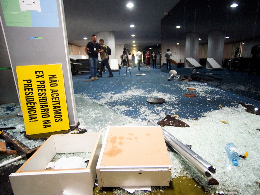 caption: Damage is seen at Brazil's Congress one day after supporters of former President Jair Bolsonaro stormed government buildings in Brasília. The attack was planned by far-right groups on social media, according to Brazilian media and analysts.
