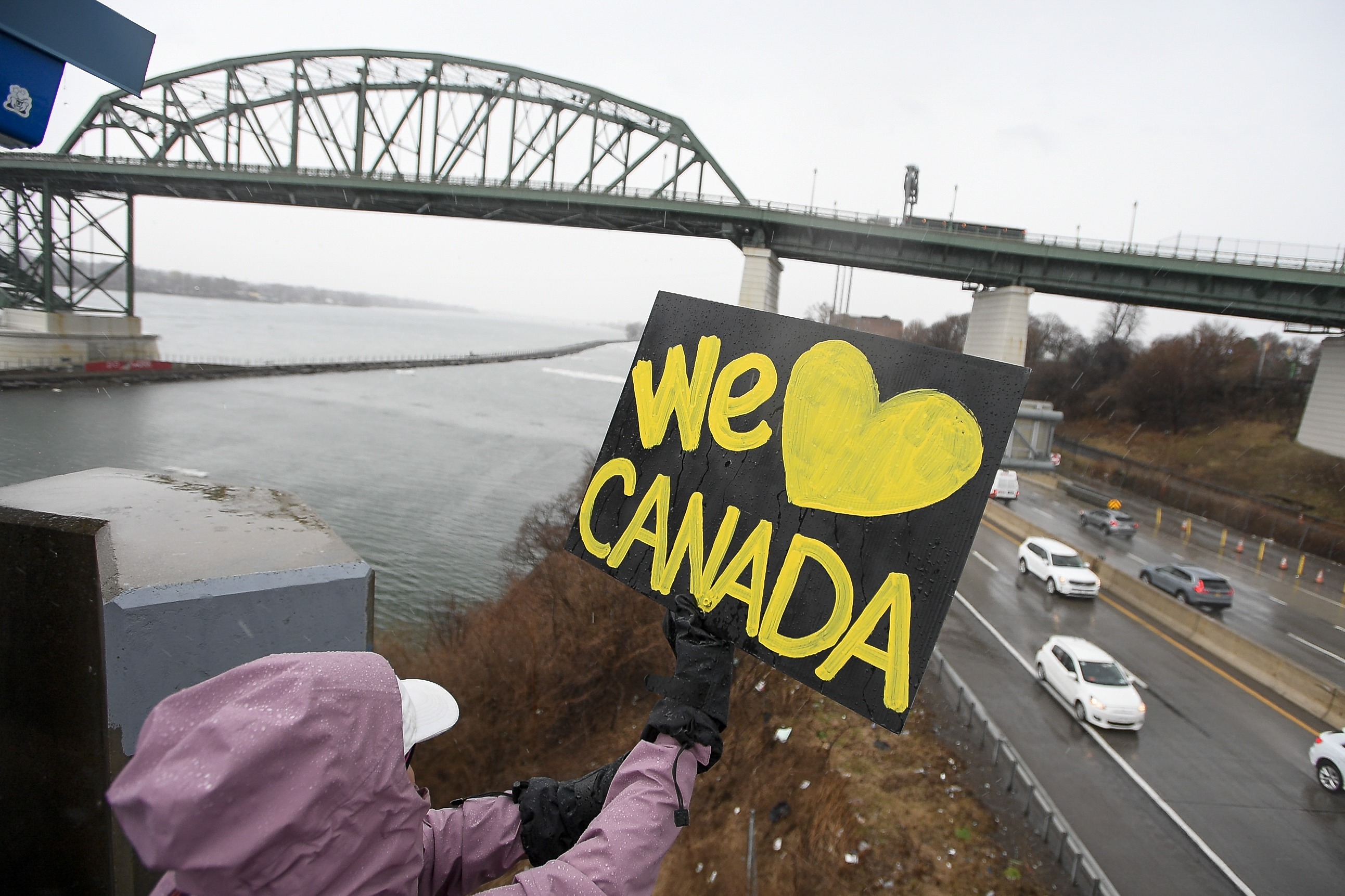 caption: Elbows Up for Canada protesters gather near The Peace Bridge border crossing in Buffalo, N.Y., Wednesday, April 2, 2025.