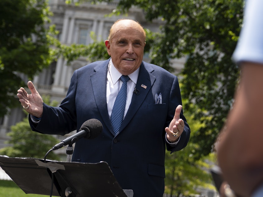 caption: Rudy Giuliani, a personal attorney for President Trump, talked with reporters outside the White House on July 1.