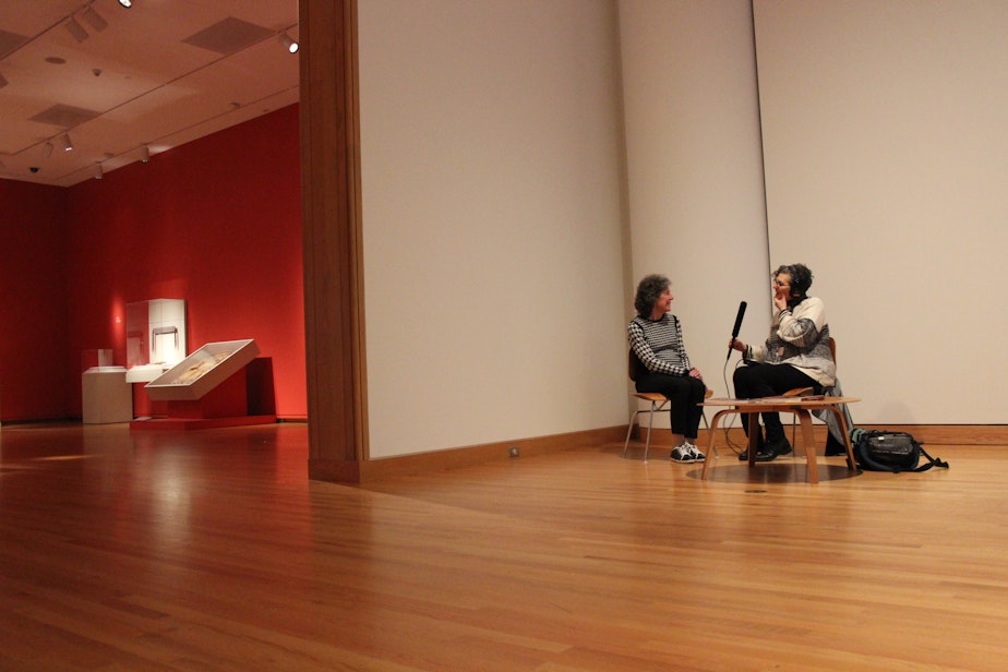 caption: Donnie Wilburn is interviewed by KUOW's Marcie Sillman at the Seattle Art Museum about its access program for visually impaired patrons. 