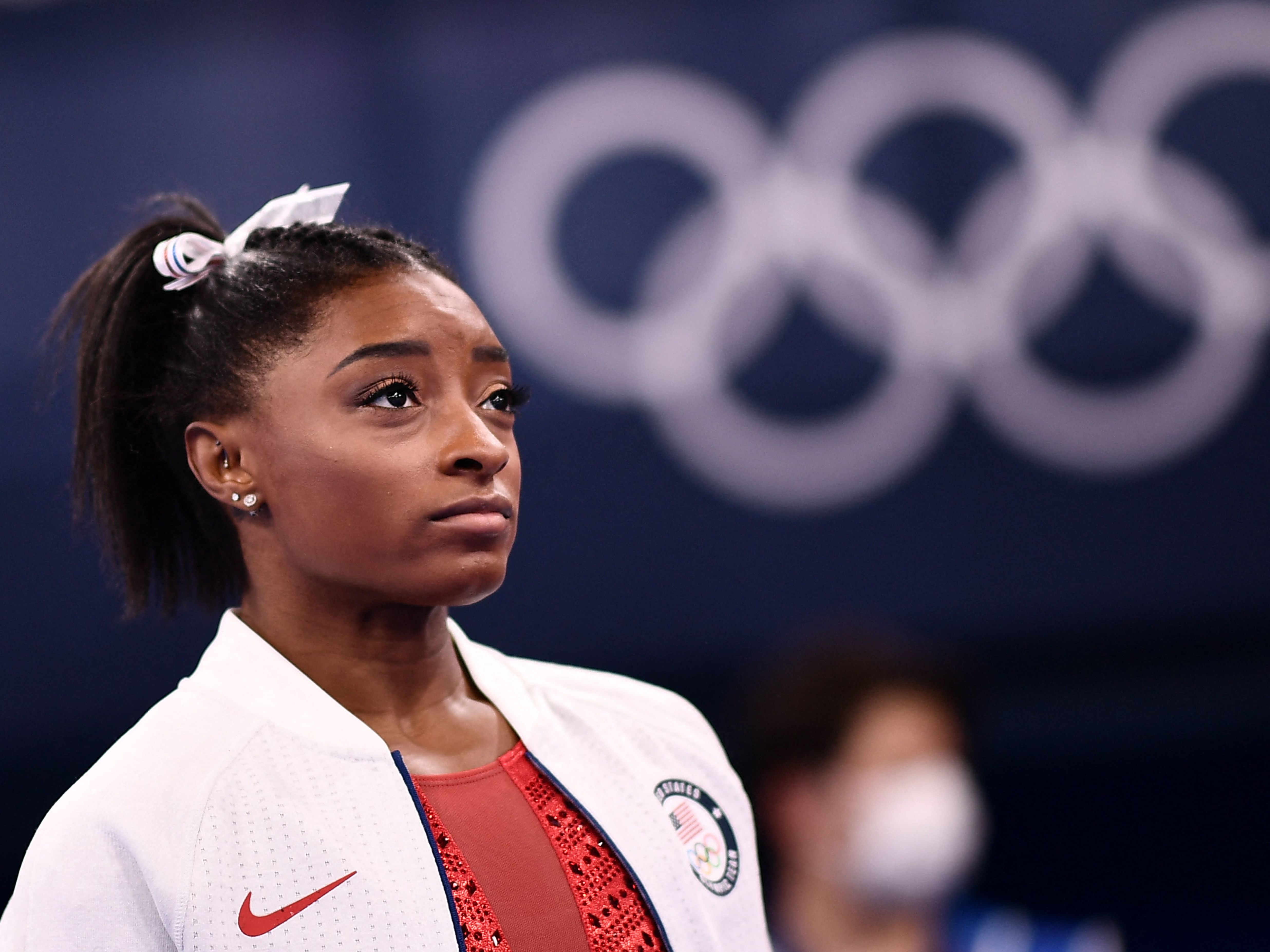 caption: USA's Simone Biles looks on during the artistic gymnastics women's team final during the Tokyo 2020 Olympic Games at the Ariake Gymnastics Centre on Sunday.