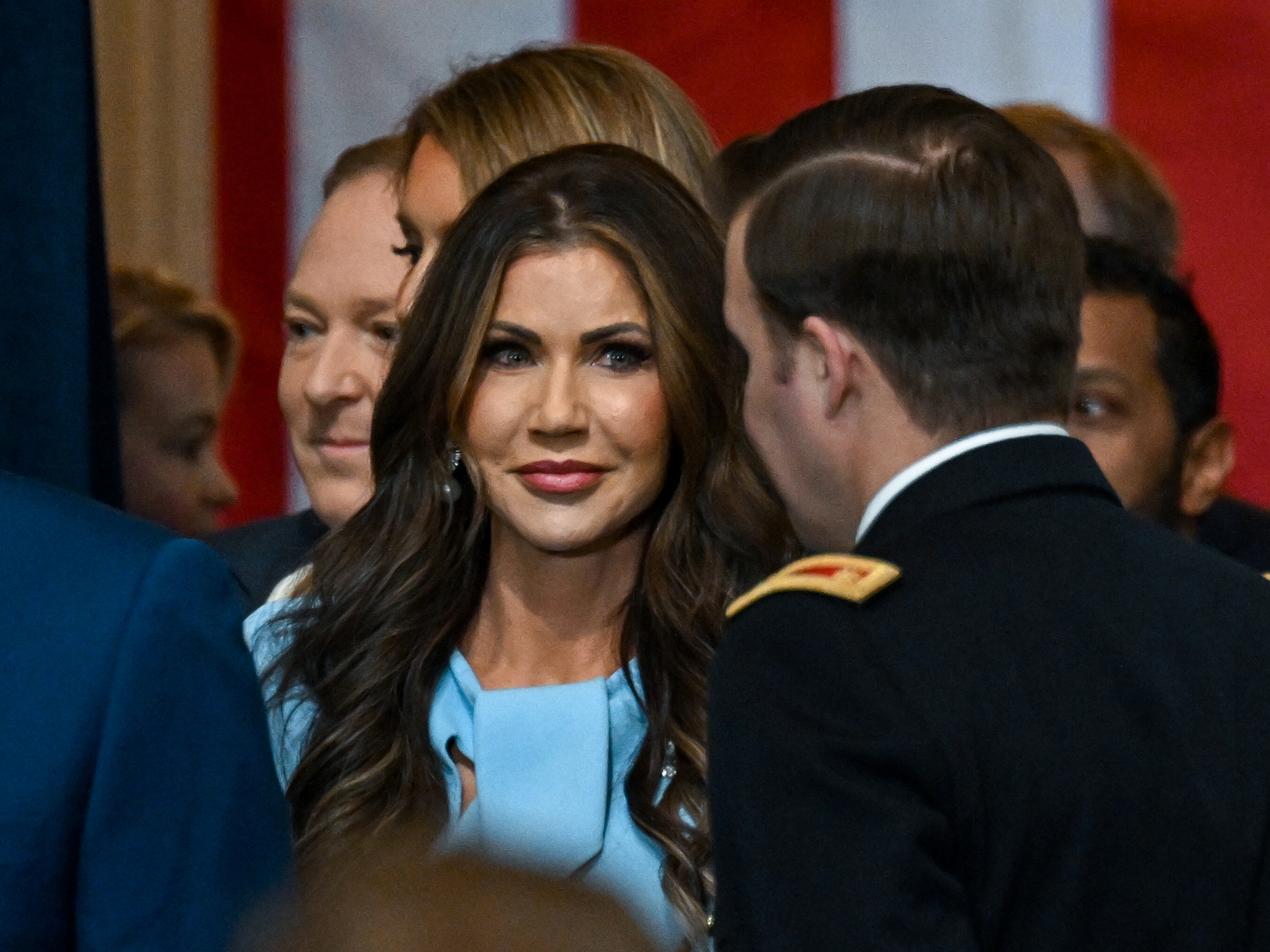 caption: Secretary of the Department of Homeland Security nominee Kristi Noem arrives for the inauguration of U.S. President-elect Donald Trump in the U.S. Capitol Rotunda on Jan. 20, 2025 in Washington, DC.