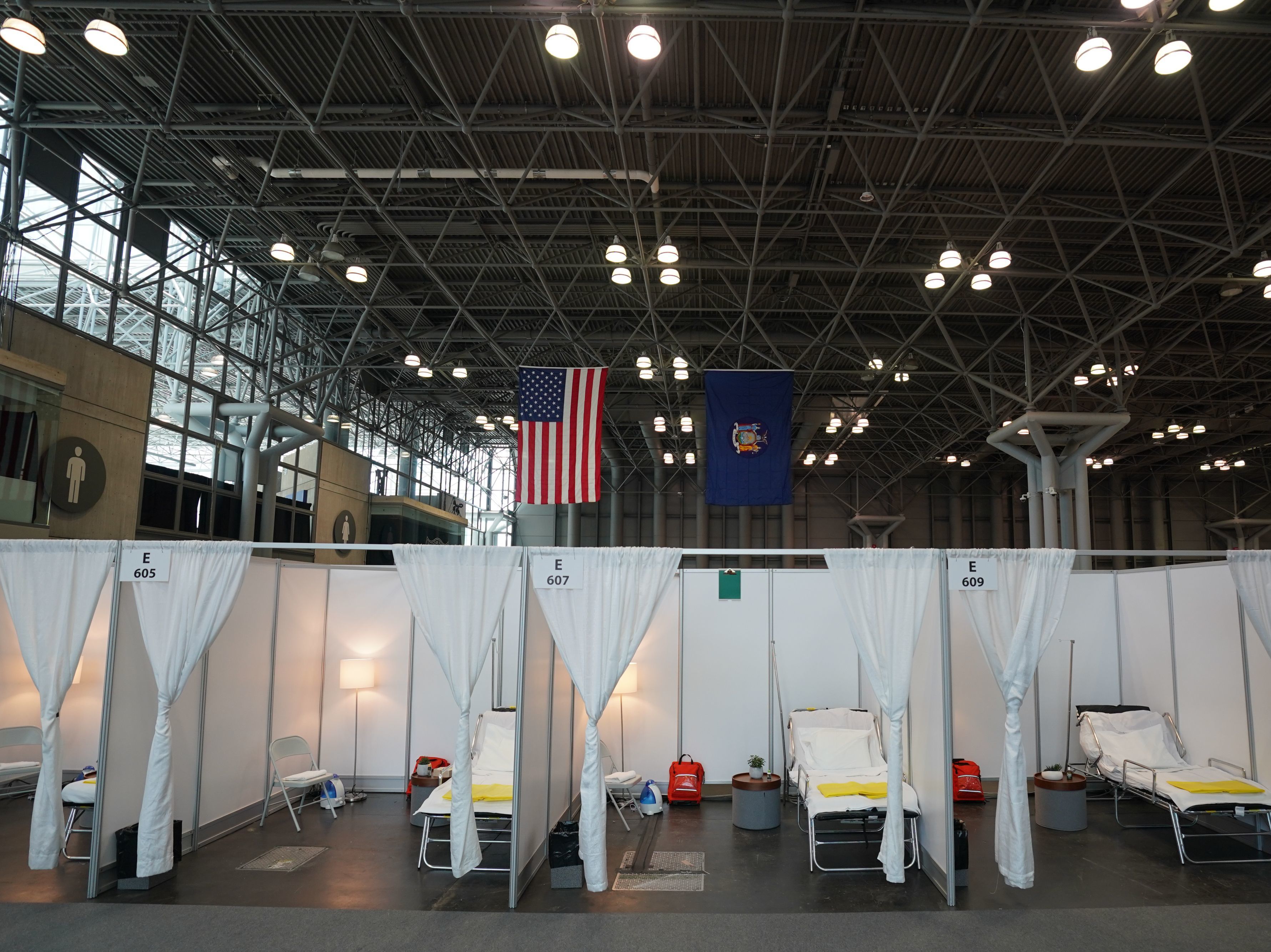 caption: Authorities are setting up a temporary hospital with 1,000 beds at the Jacob K. Javits Center, seen here Friday in New York City. The city is bracing for an overwhelming tide of patients, as its number of confirmed cases continues to rise.
