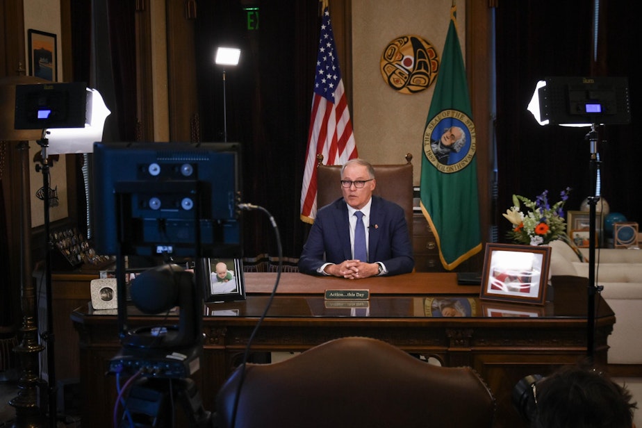 caption: Washington Gov. Jay Inslee issues a televised public address about the state's Covid-19 response on March 23, 2020. 