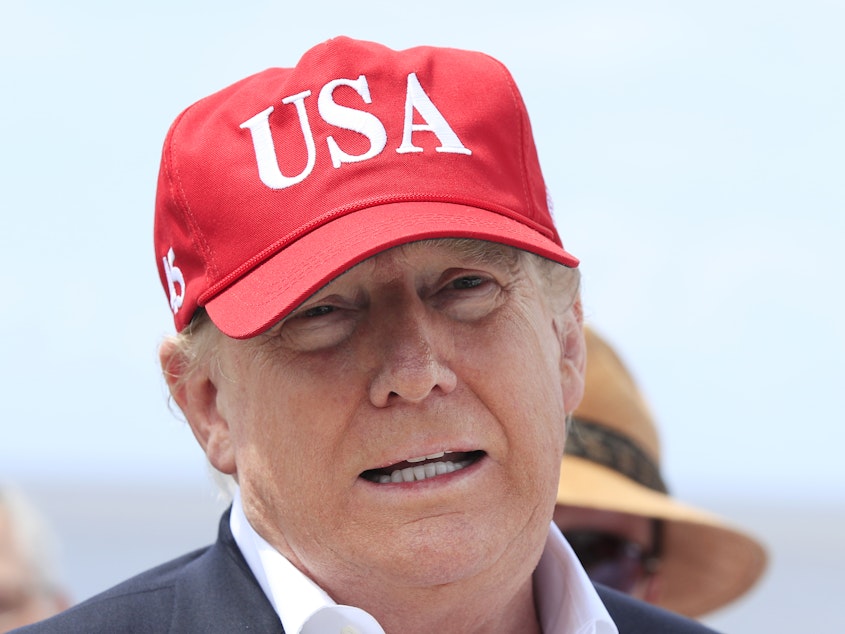 caption: President Trump says he will close the United States' Southern border, or large sections of it, next week if Mexico does not immediately stop illegal immigration. Here Trump speaks to reporters during a visit to Lake Okeechobee and Herbert Hoover Dike at Canal Point, Fla., on Friday.