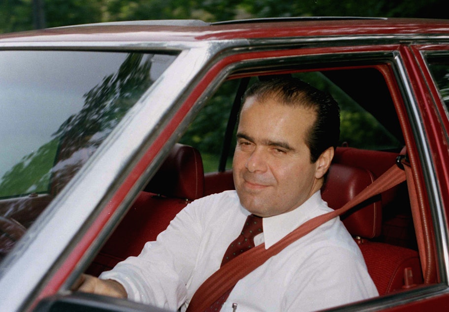 caption: Antonin Scalia departs his McLean, Virginia., residence on Aug. 5, 1986, enroute to Capitol Hill. Scalia was scheduled to appear before the Senate Judiciary Committee which was beginning confirmation hearings on his nomination.