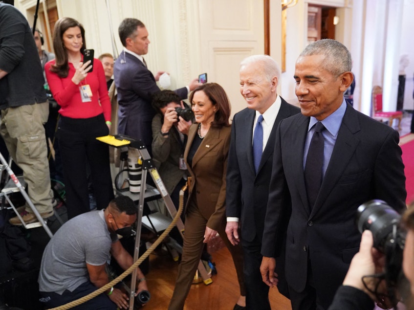caption: Vice President Kamala Harris, President Joe Biden and former President Barack Obama arrive to deliver remarks on the Affordable Care Act and Medicaid in the East Room of the White House on Tuesday.