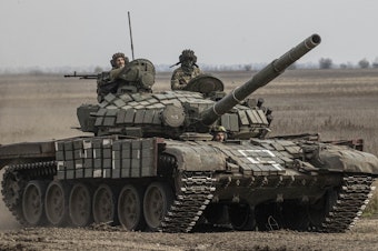 caption: Ukrainian Armed Forces in a tank heading toward the Kherson front in Kherson region on Wednesday.