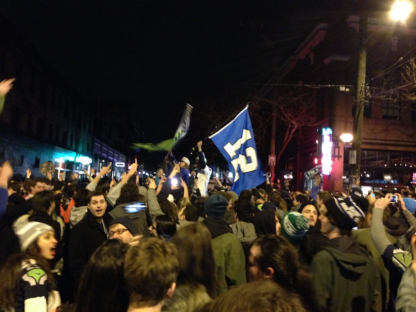 caption: Fans celebrated in Capitol Hill after the Seahawks' Super Bowl victory on Sunday.