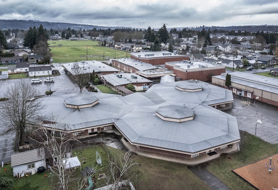 caption: A drone shot of Sky Valley Education Center taken on Dec. 23, 2021. In the foreground is a cluster of classrooms where some of the highest PCB levels were detected during campus inspections. 