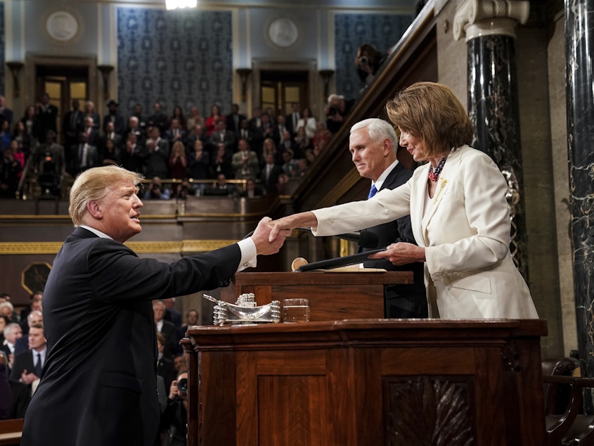 caption: President Trump shakes hands with House Speaker Nancy Pelosi as Vice President Pence looks on, as he arrives in the House chamber before giving his State of the Union address to a joint session of Congress Feb. 5, 2019.