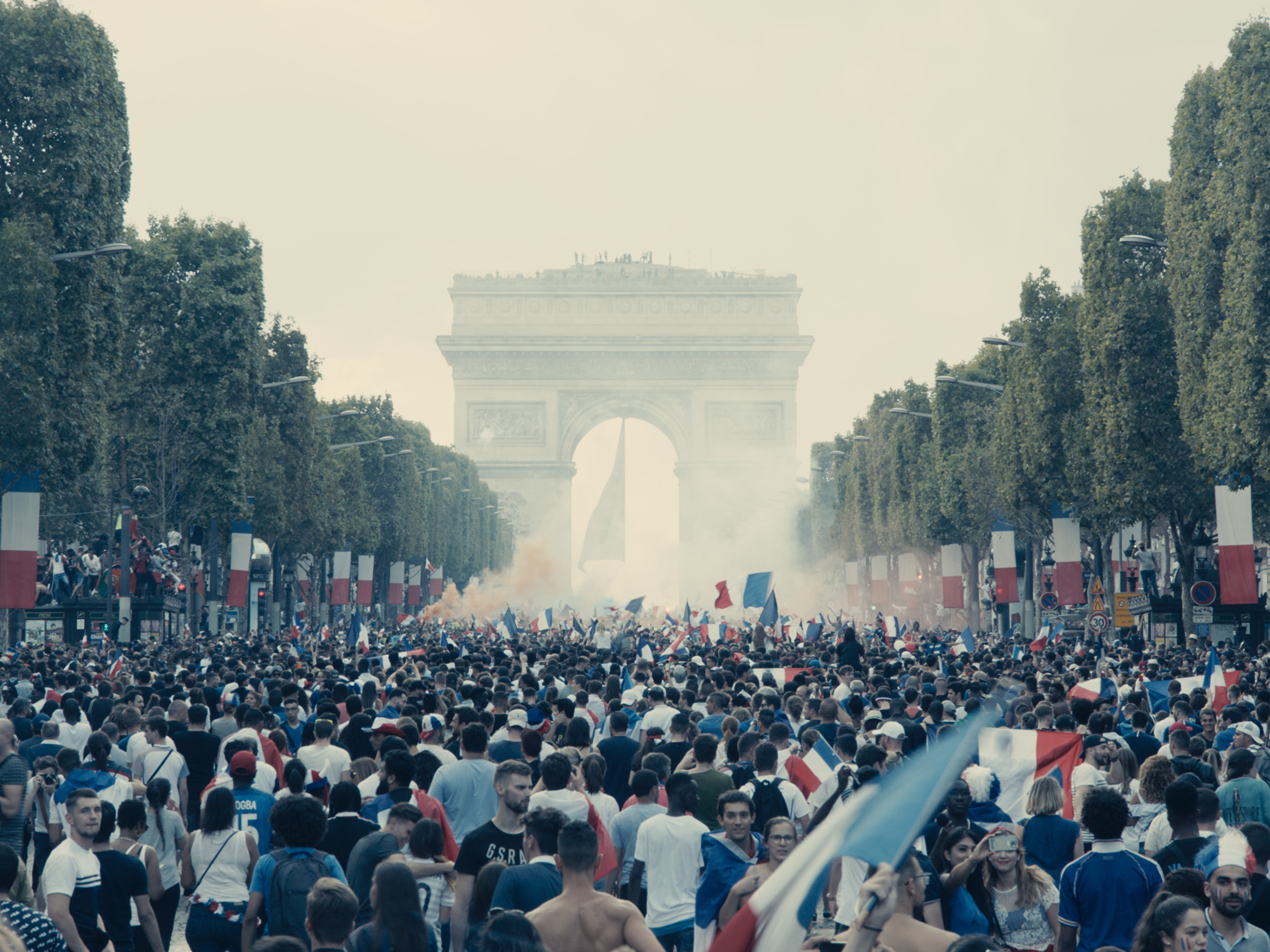 caption: Ladj Ly's 2019 film<em> Les Misérables </em>opens on an ecstatic scene — France has just won the World Cup and happy Parisians are celebrating in the streets.
