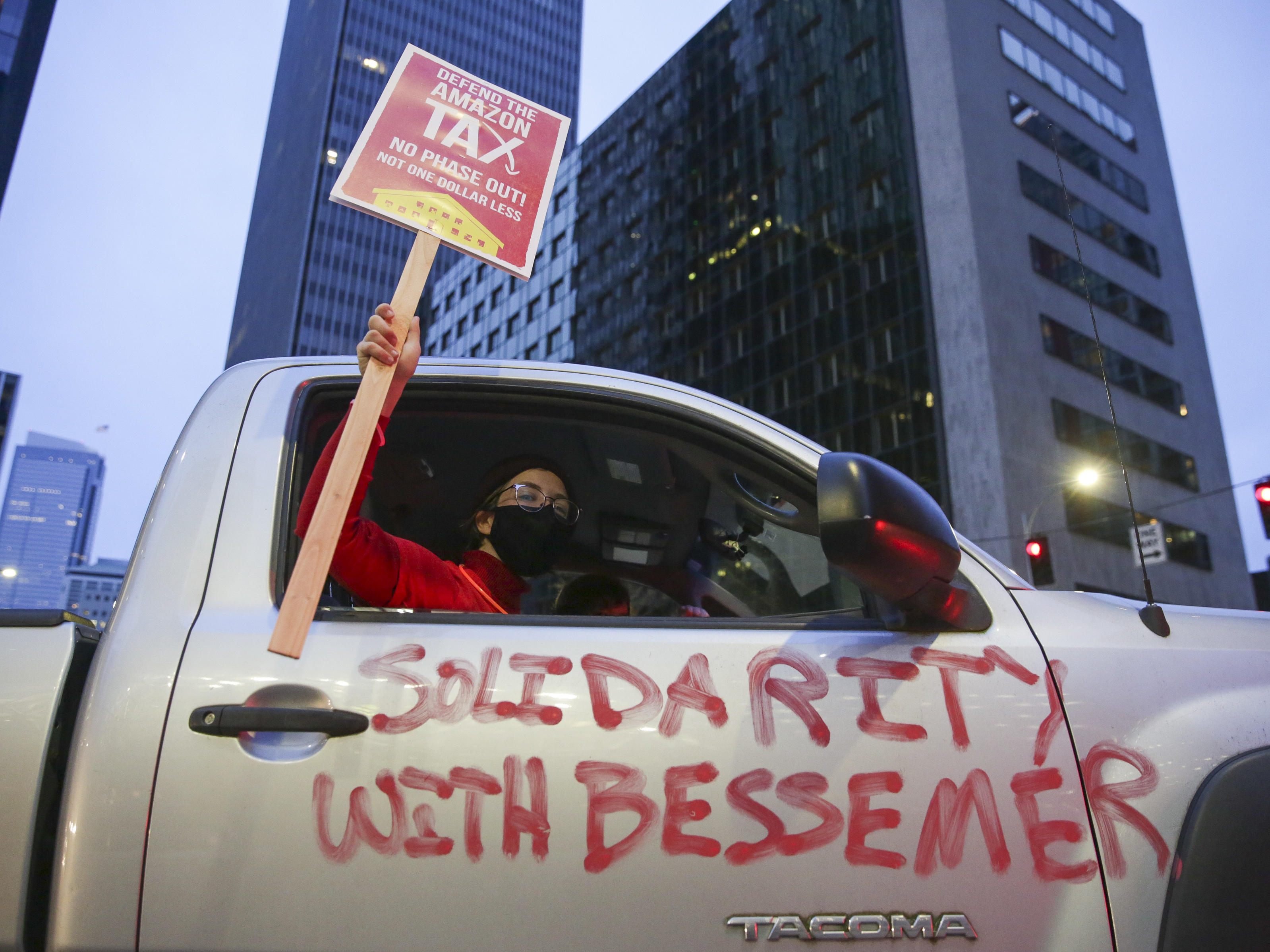 caption: More than 5,800 warehouse workers at the Bessemer, Ala., Amazon facility are voting this month on whether to join the Retail, Wholesale and Department Store Union. Supporters are protesting in solidarity with those workers.