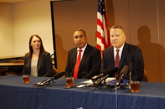 caption: Jay S. Tabb, Jr. (far right) heads the FBI's Seattle office.