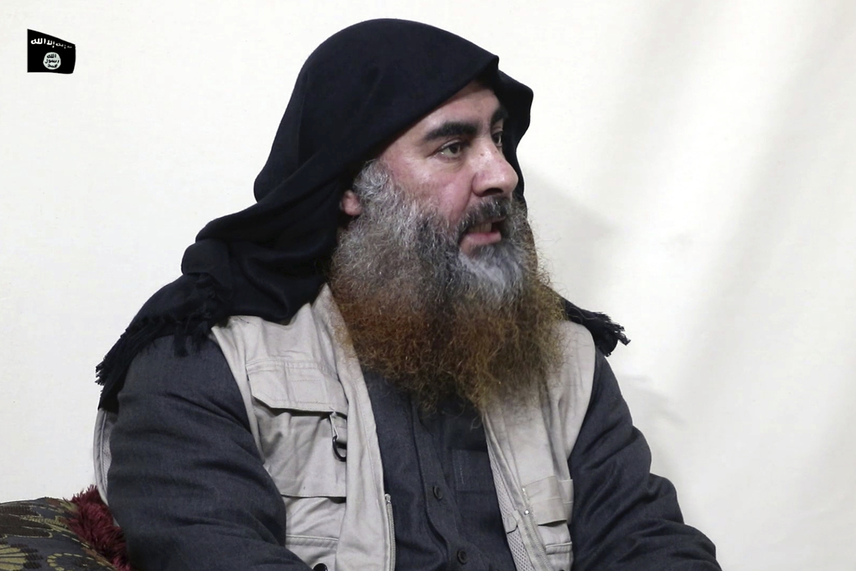 caption: This file image made from video posted on a militant website April 29, 2019, purports to show the leader of the Islamic State group, Abu Bakr al-Baghdadi. (Al-Furqan media via AP, File)