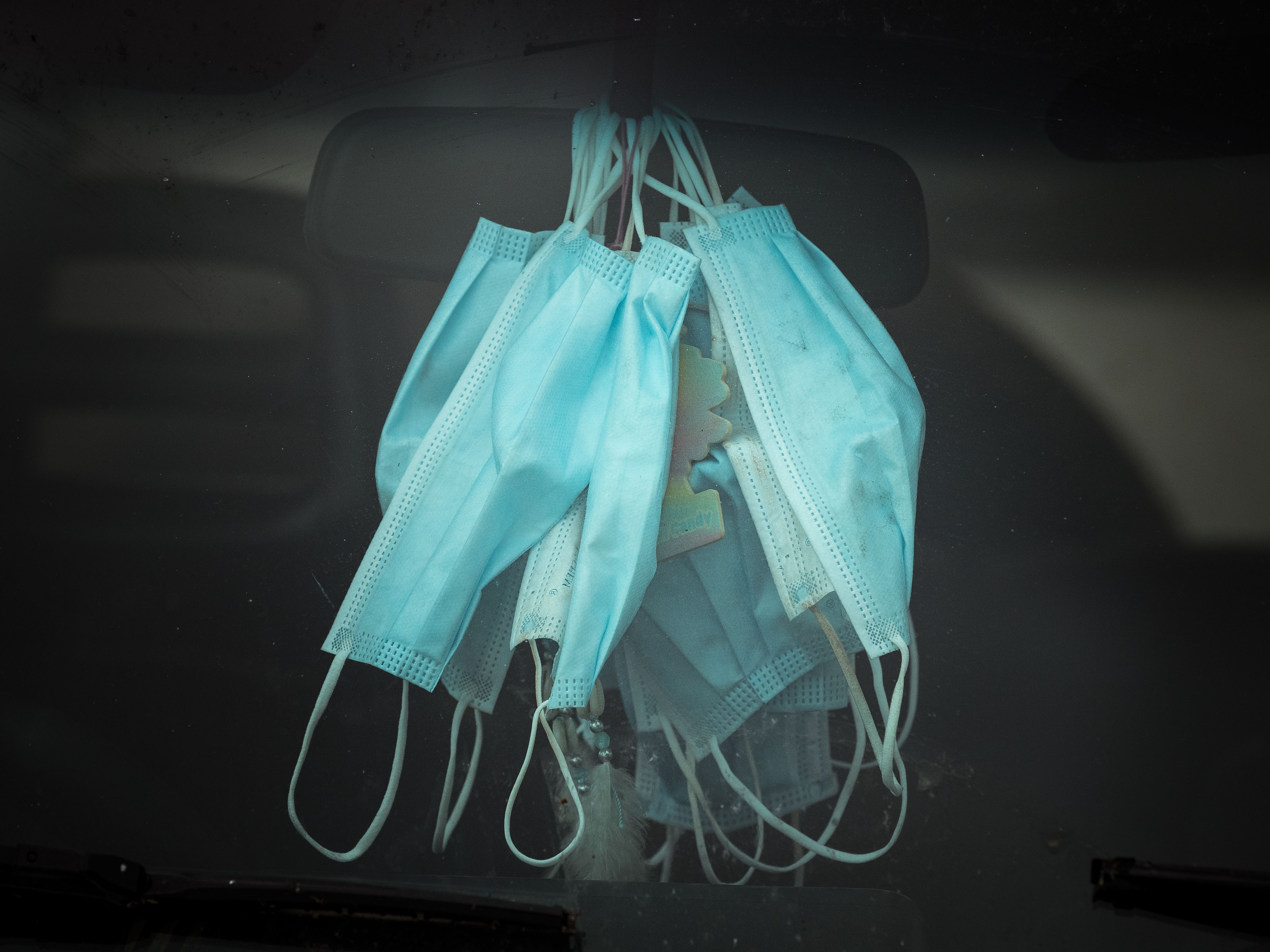 caption: Masks have become less and less common in public.