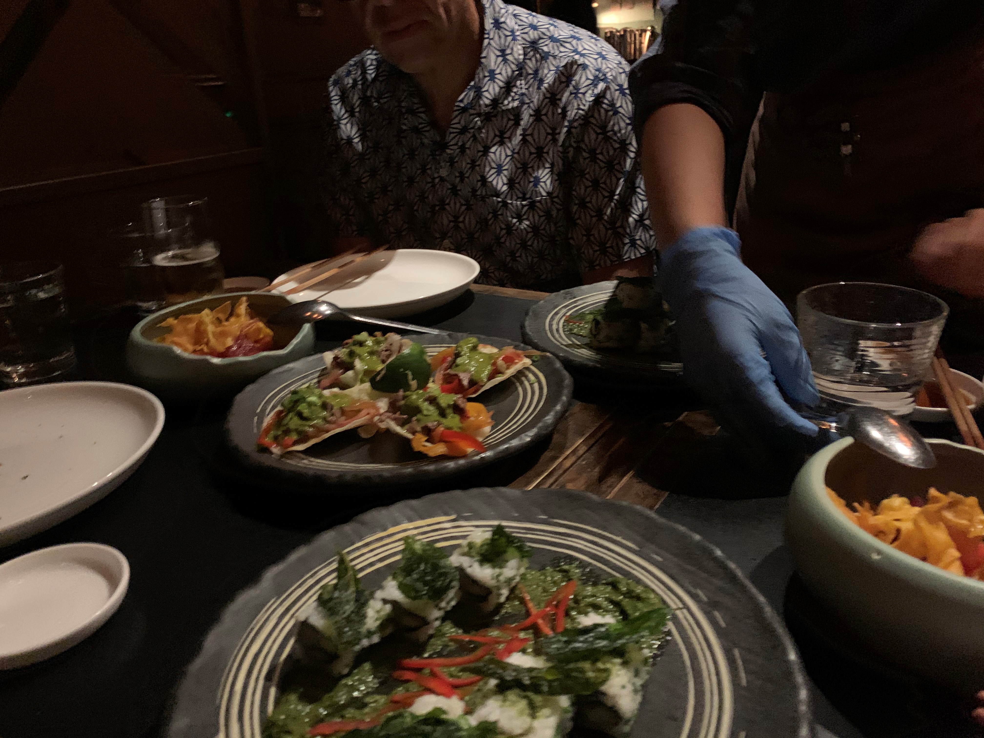 caption: Hong Kong residents dine in, but with some restrictions.