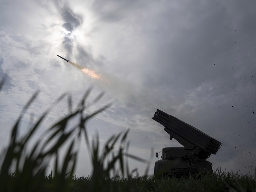 caption: A Ukrainian MSLR BM-21 "Grad" fires toward Russian positions in the Donetsk region of eastern Ukraine, April 8.