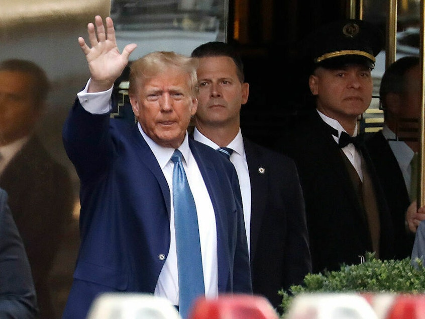 caption: Former President Donald Trump leaves Trump Tower on April 13 in New York City. A trial is set to begin Monday over allegations that Trump and his associates, including some of his children, committed fraud to do business.