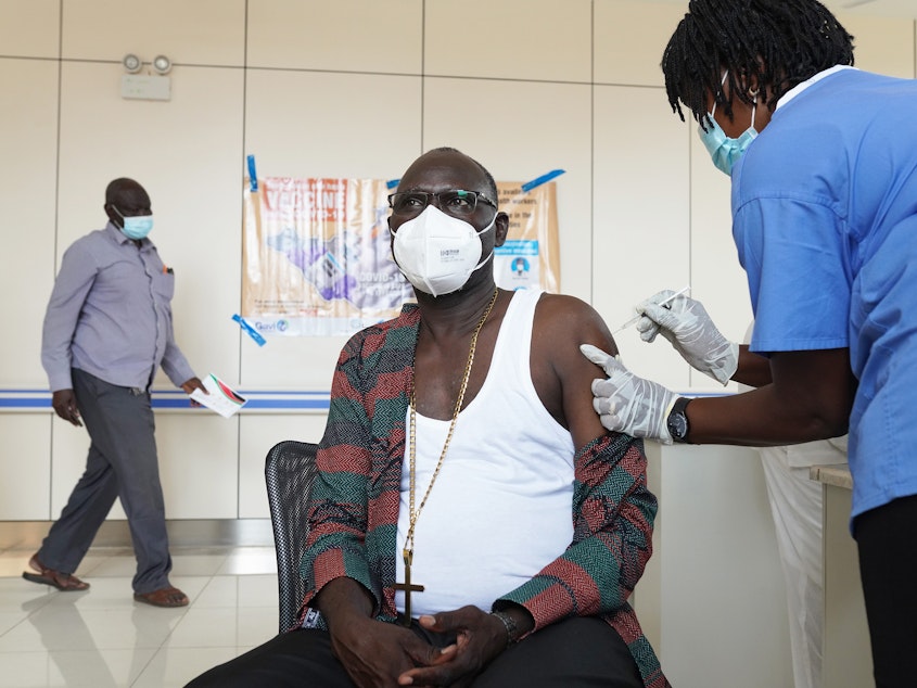 caption: A bishop receives a vaccine for COVID-19 at Juba Teaching Hospital on April 7 in Juba, South Sudan. South Sudan received 132,000 doses of the Oxford-AstraZeneca vaccine on March 25 through the World Health Organization's COVAX program to ensure all countries have equal access to vaccines.