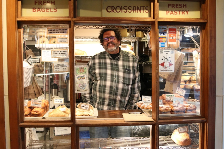 caption: Jack Levy of Three Girls Bakery says things at the Pike Place Market are slow, but businesses there have been through World War 1, the Spanish Flu, The Great Depression, many recessions... "We're going to be okay," he said.