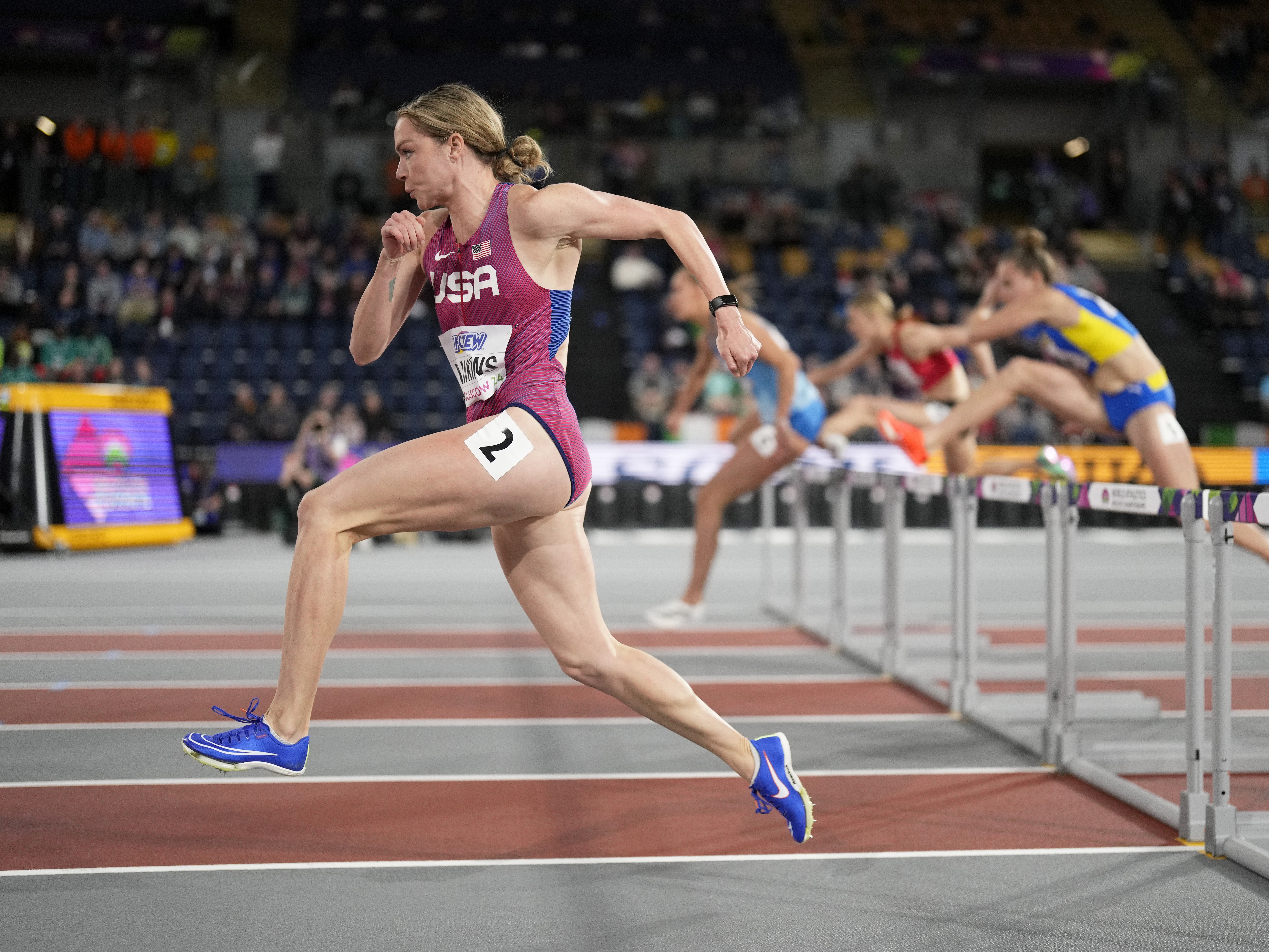 caption: Chari Hawkins competes during the World Athletics Indoor Championships in Glasgow, Scotland, in March 2024. She's representing Team USA in the heptathlon this week in the Paris Olympics.