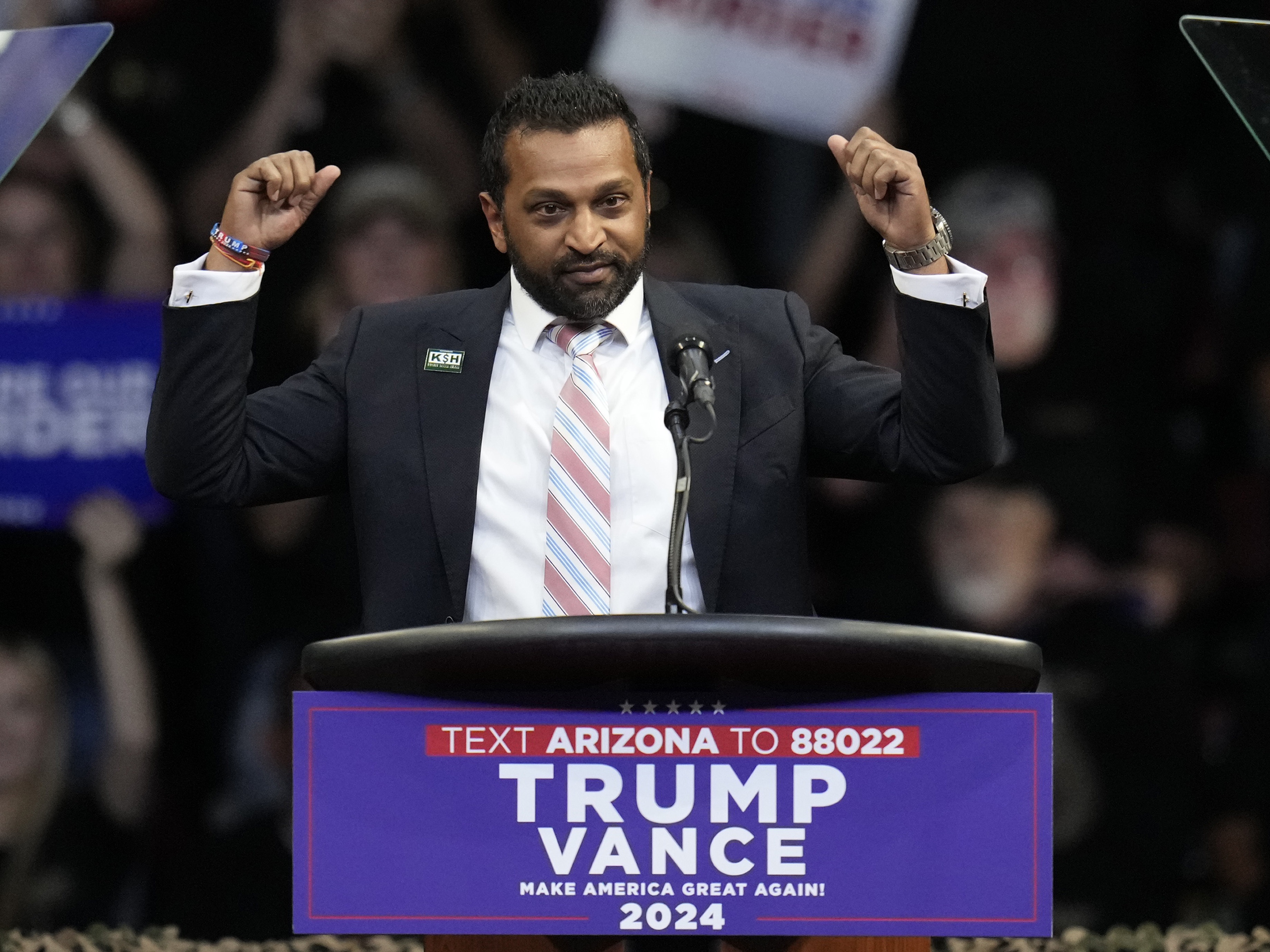 caption: Kash Patel speaks before then-Republican presidential nominee, former President Donald Trump, at a campaign rally at the Findlay Toyota Arena, on Oct. 13, 2024, in Prescott Valley, Ariz.