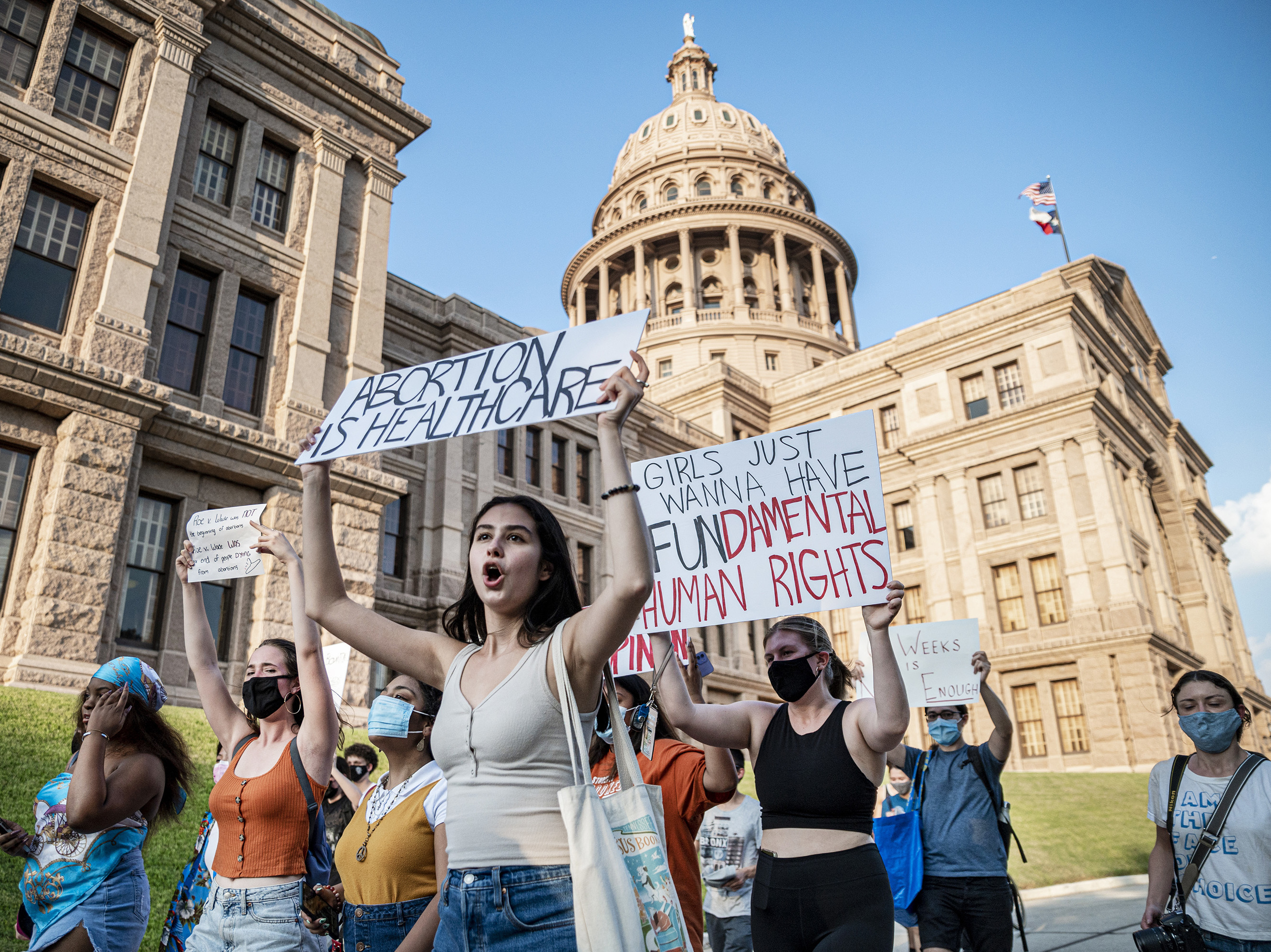 caption: Abortion-rights supporters march outside the Texas Capitol in Austin on Sept. 1.