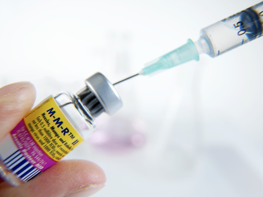 caption: MMR vaccine being drawn into a syringe. This combined vaccine protects children from three viral diseases: measles, mumps and rubella.