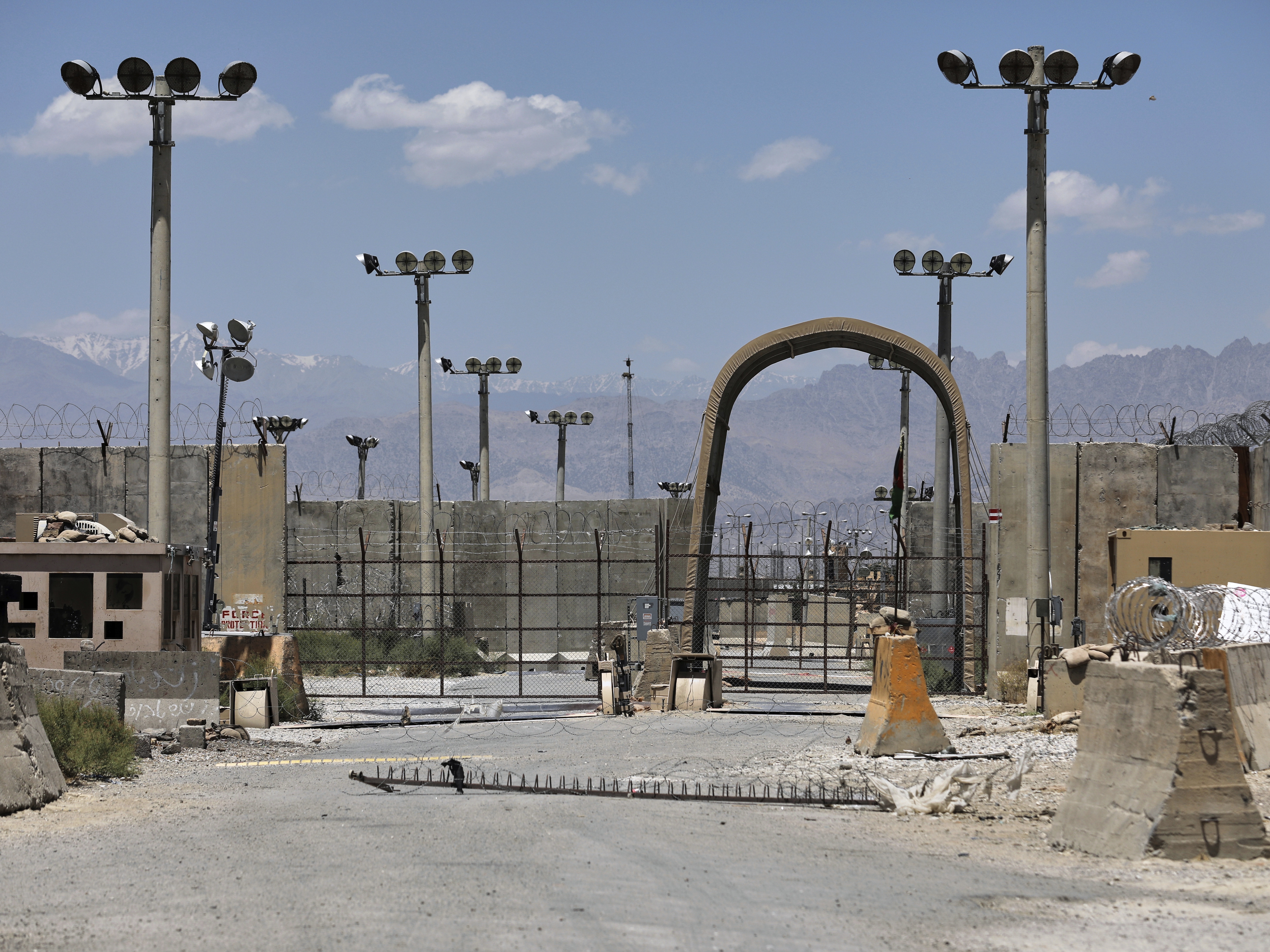 caption: FILE - A gate is seen at the Bagram Air Base in Afghanistan, Friday, June 25, 2021. President Donald Trump has suggested he's working to reestablish a U.S. presence at Bagram Air Base in Afghanistan. That comes four years after America's chaotic withdrawal from the country left the base in the Taliban's hands.