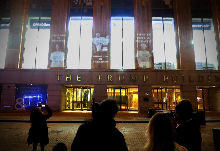 Shout Your Abortion projections cover the Trump Building on Wall Street in NYC for the 44th anniversary of Roe v. Wade. These visuals were projected and facilitated by NYC activist crew The Illuminators.