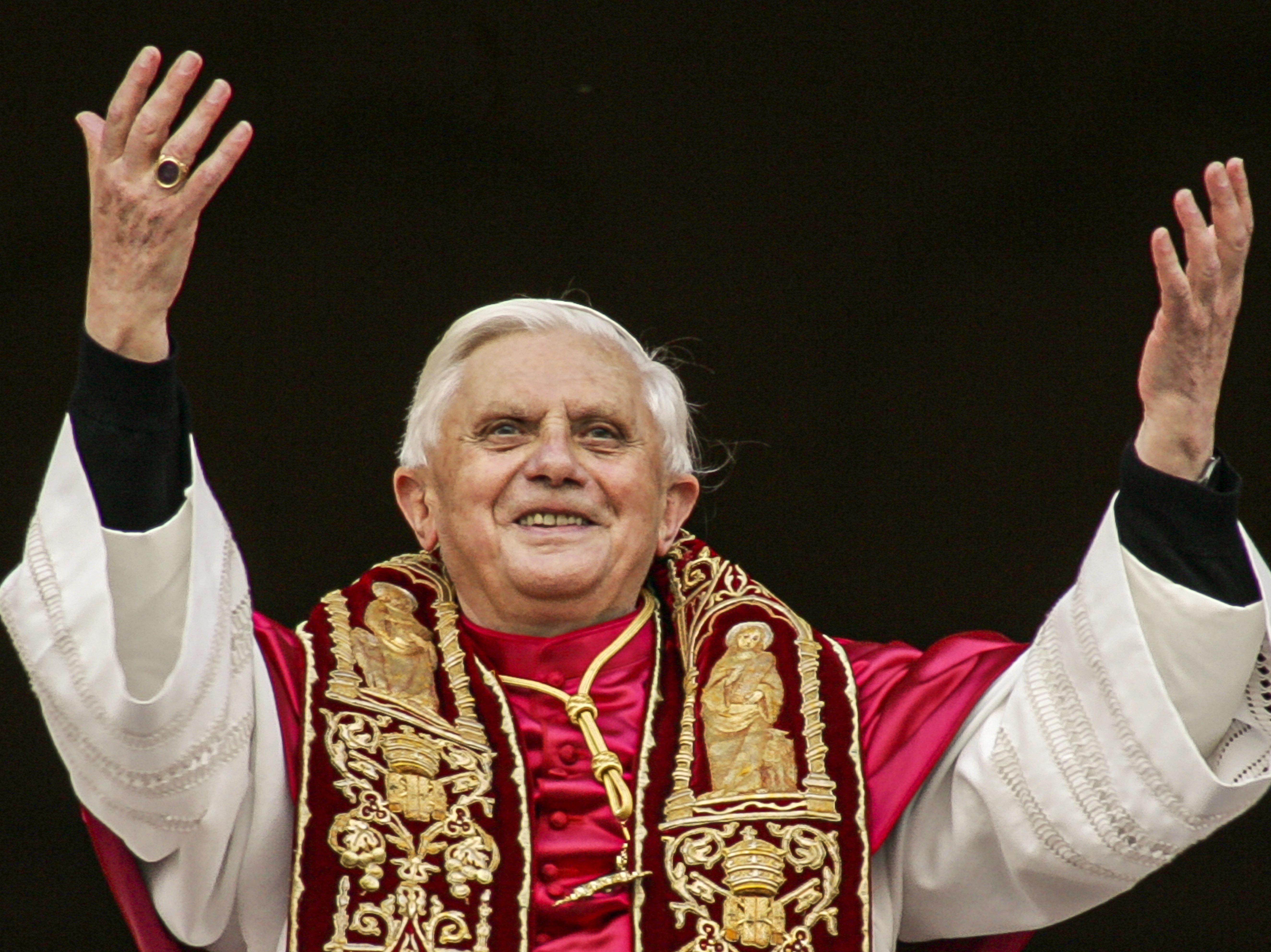 caption: Pope Benedict XVI greets the crowd from the central balcony of St. Peter's Basilica at the Vatican in 2005, soon after his election.
