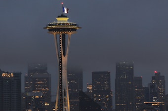 caption: The French flag flies over the Space needle on Saturday Nov. 14. It was one of several displays of solidarity with France in Seattle after the terrorist attacks on Nov. 13.