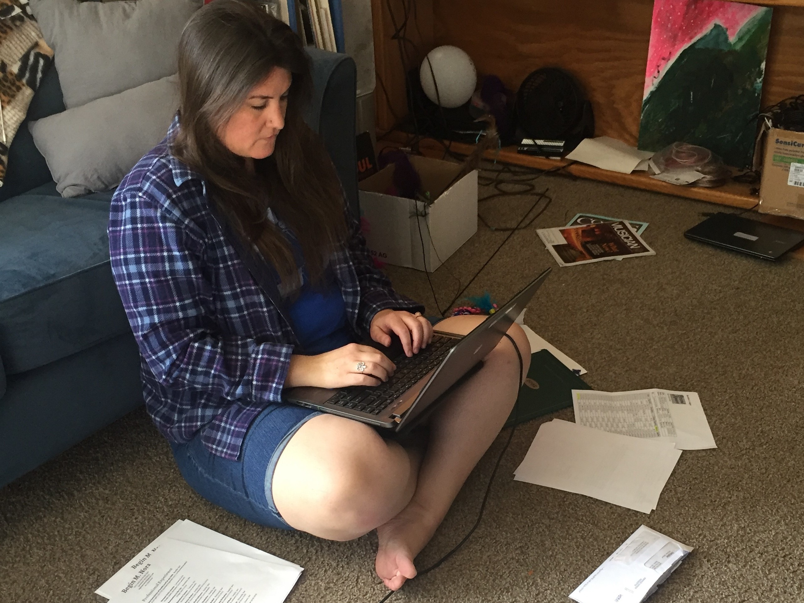 caption: Seattle musician Begin Nora lost all her income in the pandemic. With three teenagers to feed, the family is eager to get the emergency government money.