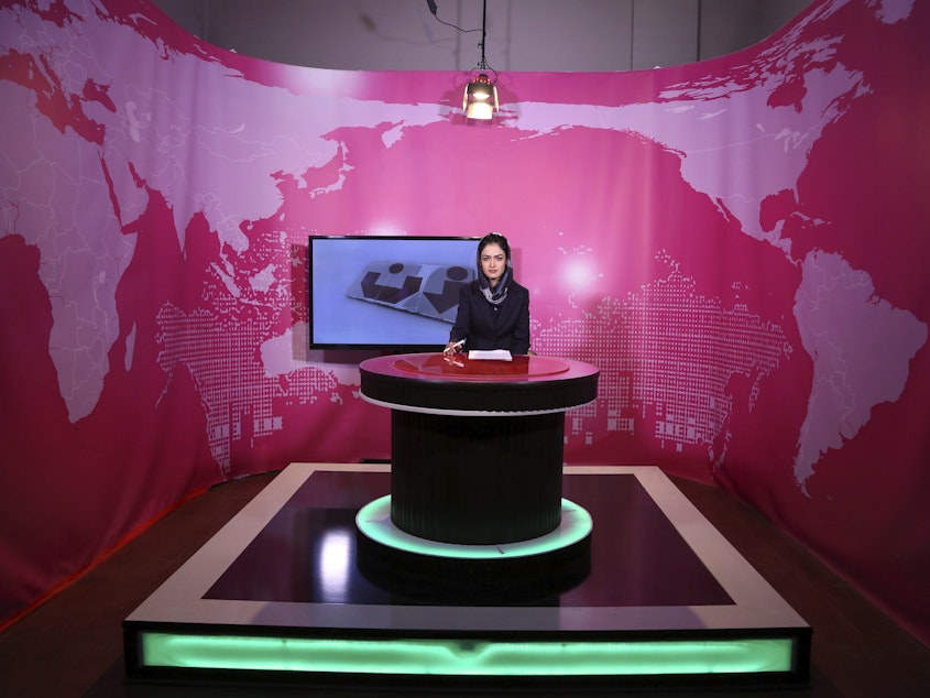 caption: Basira Joya, 20, a news presenter, sits during recording at the Zan TV station (women's TV) in Kabul, Afghanistan, on May 30, 2017. Afghanistan's Taliban rulers ordered all female TV presenters to cover their faces on air, the country's biggest media outlet said on Thursday.