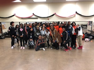 caption: 7th and 8th grade students pose with teacher Kimberly Lane  Clark for 2019 Lancaster Middle School Career Day. Clark's session that day was titled, What does a Computer Scientist look like? 