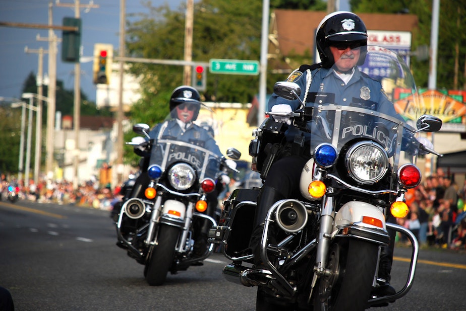 caption: File photo of Seattle Police at Greenwood Parade in 2008.