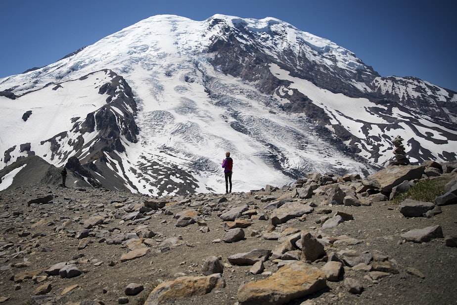 caption: Hikers stand along Burroughs Mountain Trail with a view of Mount Rainier on Saturday, July 20, 2019.
