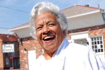 caption: Chef Leah Chase stands outside her famous Creole restaurant, Dookie Chase's, which was flooded out during Hurricane Katrina, on March 9, 2007, in New Orleans.