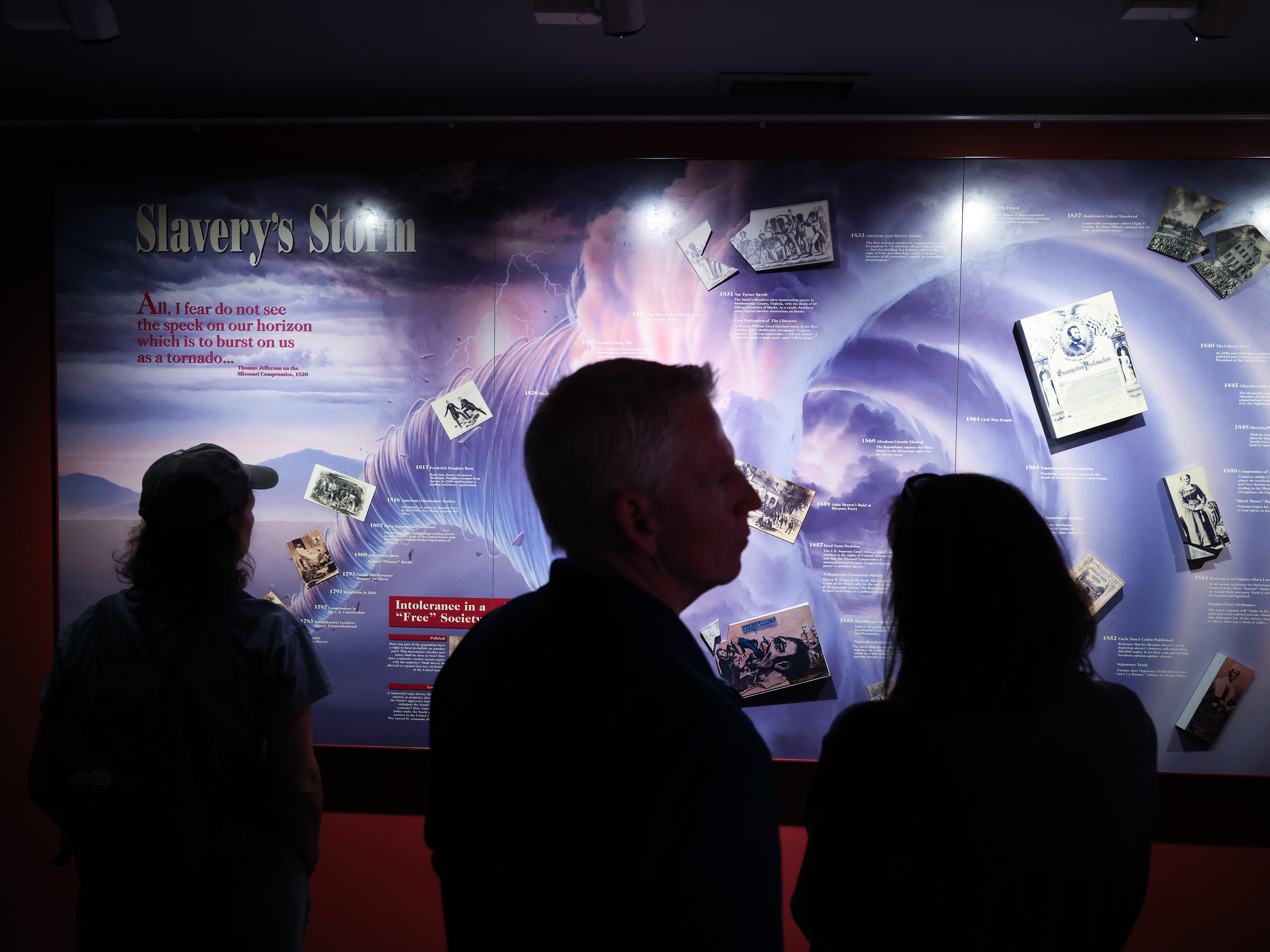 caption: Visitors view exhibits related to slavery at the John Brown Museum at the Harpers Ferry National Historical Park  in Harpers Ferry, W. Va. According to Marilyn Jackson, CEO of the American Alliance of Museums, President Trump's actions towards museums has led to a decrease in philanthropic funding.