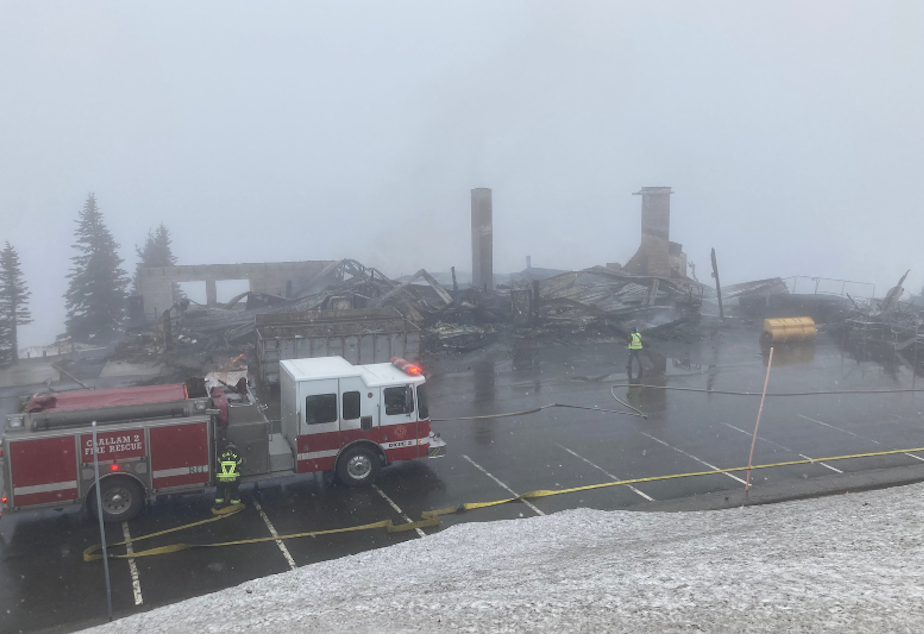 caption: The Hurricane Ridge Day Lodge, a popular destination in Olympic National Park, caught fire Sunday, May 7. Park officials say the structure appears to be a complete loss.