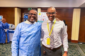 caption: Dr. Bushra Sulieman (left) and Dr. Mohamed Eisa in February 2023 at a workshop in Khartoum. Sulieman was killed on April 25 in Khartoum. It's believed he was stabbed to death during a robbery attempt amid the turmoil of the conflict that has broken out in Sudan.