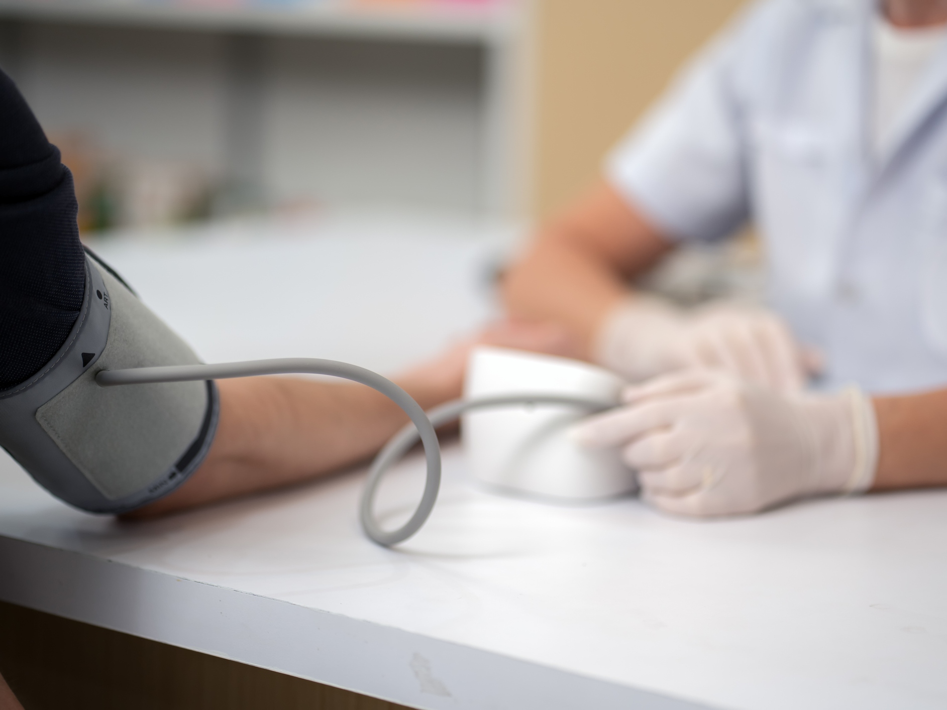 caption: A patient's arm should be supported at around heart level when taking blood pressure readings.