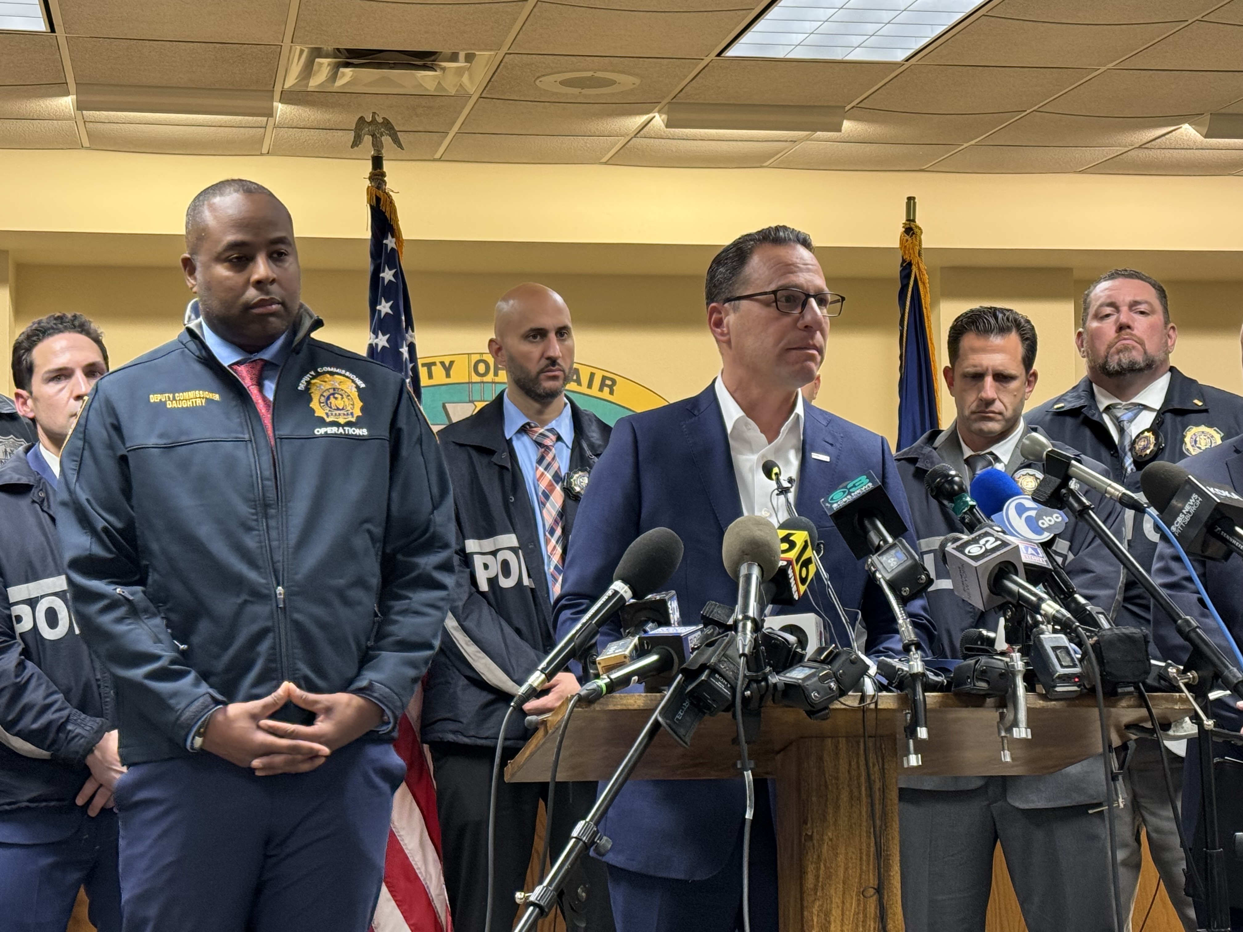 caption: Pennsylvania Gov. Josh Shapiro speaks during a press conference after the arraignment of shooting suspect Luigi Mangione on Monday evening in Hollidaysburg, Pa.
