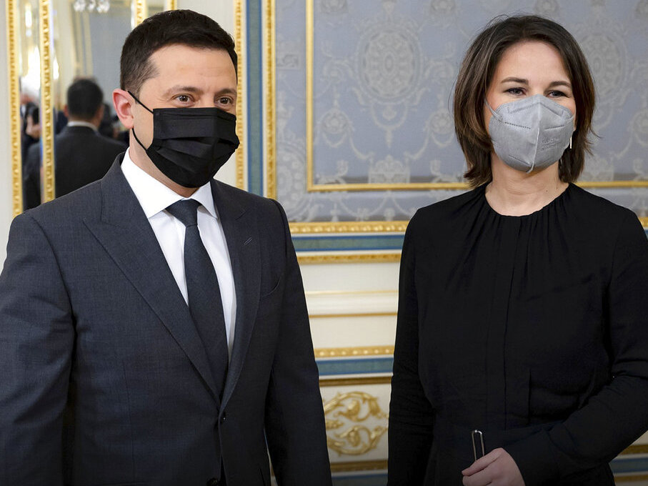 caption: In this photo provided by Ukrainian Presidential Press Office, Ukrainian President Volodymyr Zelenskyy, left, and German Foreign Minister Annalena Baerbock pose for a photo during their meeting in Kyiv, Ukraine, Monday, Jan. 17, 2022.