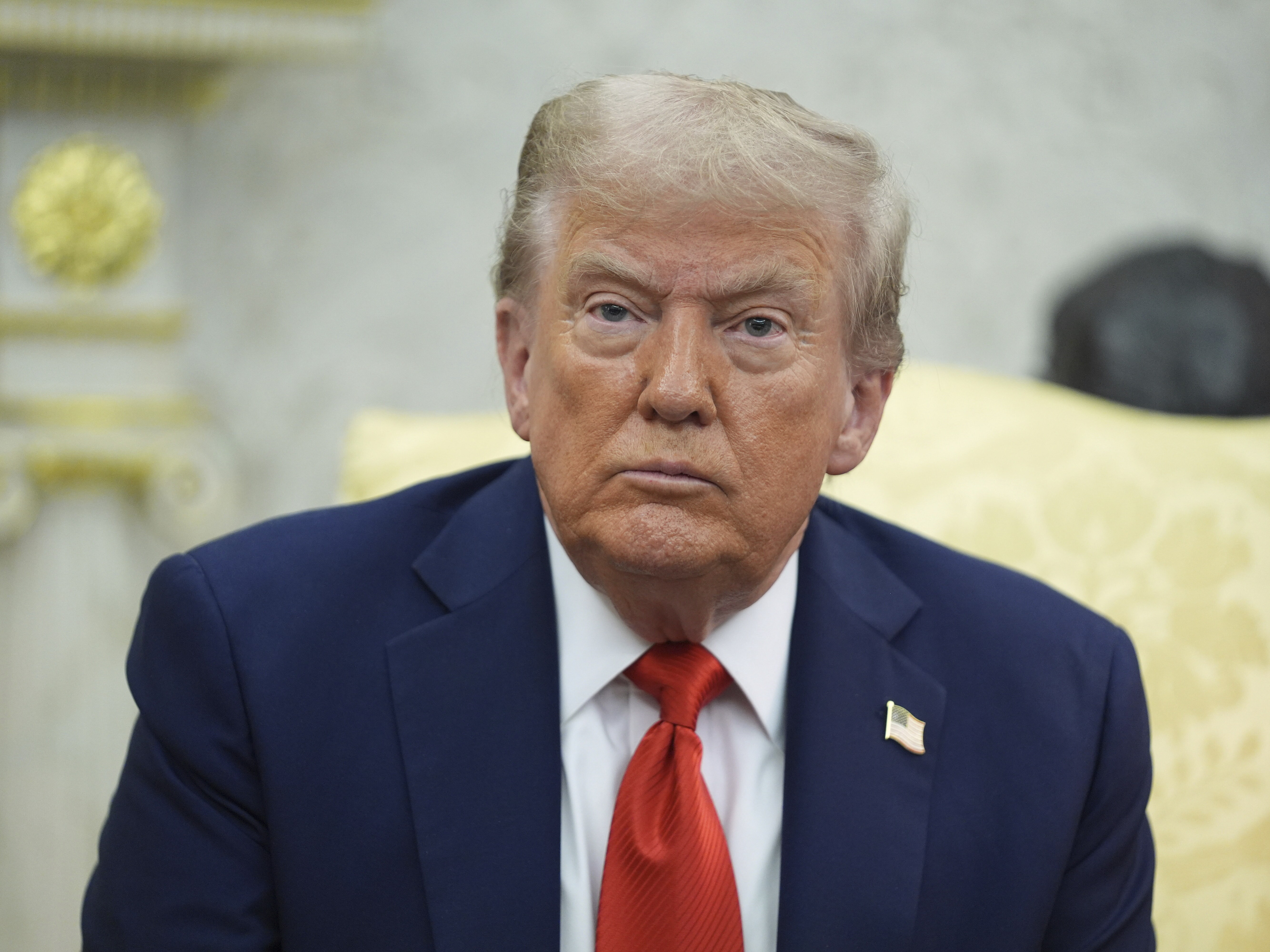 caption: President Donald Trump listens during a meeting with Polish President Karol Nawrocki in the Oval Office of the White House on Sept. 3, 2025, in Washington.